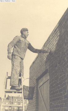Whitewashing a building at the pioneering training farm (hachshara) of the He-Chaluts movement in Grochow. in 1937 or 1938